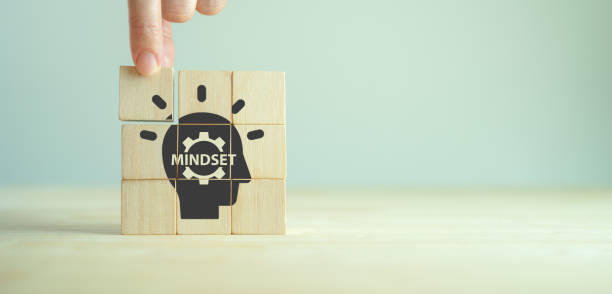 Business mindset and success concept. Growth and personal development. Believing in yourself matters. New mindset new results. Placing wooden cubes with changing mindset icon on smart background. stock photo