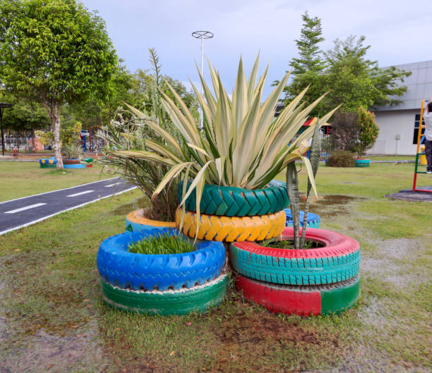 istock flower pots from used rubber car tires 1409806816