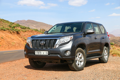 Al Haouz Province, Morocco - September 23, 2019: Offroad car Toyota Land Cruiser Prado 150 in the Atlas Mountains.