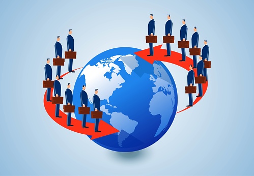 The concept of communication and cooperation in global business finance and economic development, a group of businessmen stand on arrows around the earth
