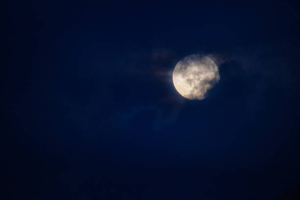 istock The supermoon looms in the clouds. 1409815334