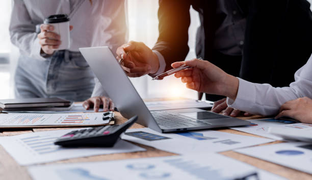 istock Business Team working at office with documents on his desk, doing planning analyzing the financial report, business plan investment, finance analysis concept 1409815496