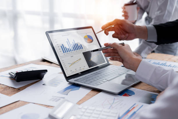 istock Business Team working at office with documents on his desk, doing planning analyzing the financial report, business plan investment, finance analysis concept 1409815506
