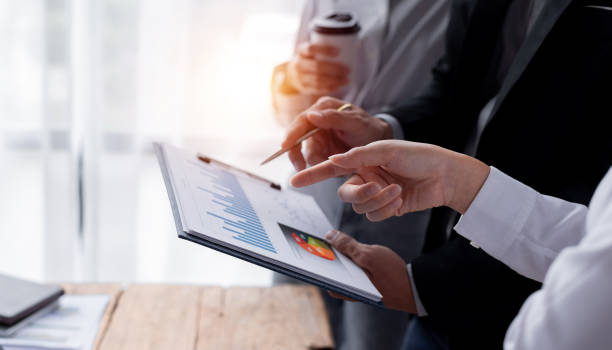 istock Business Team working at office with documents on his desk, doing planning analyzing the financial report, business plan investment, finance analysis concept 1409815513