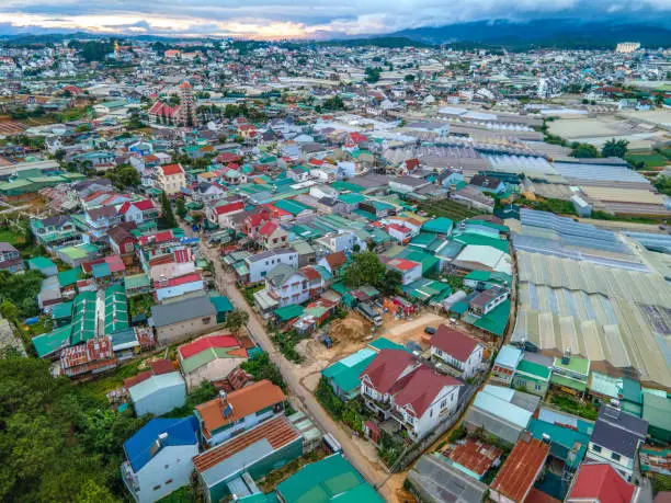 Photo of DA LAT CITY, VIETNAM - JULY 15,2022 : Landscape in the city of Da Lat city, Vietnam is a popular tourist destination. Tourist city in developed Vietnam. ( view aerial from drone )