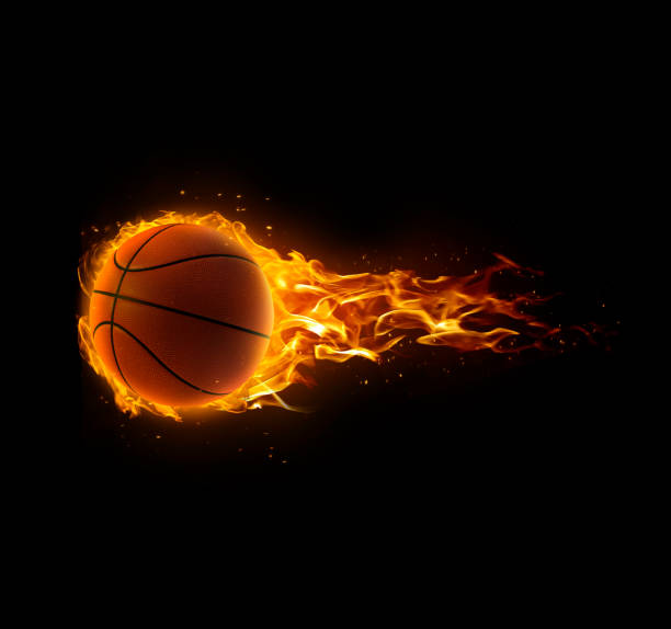 istock Basketball on fire on black background 1409820235