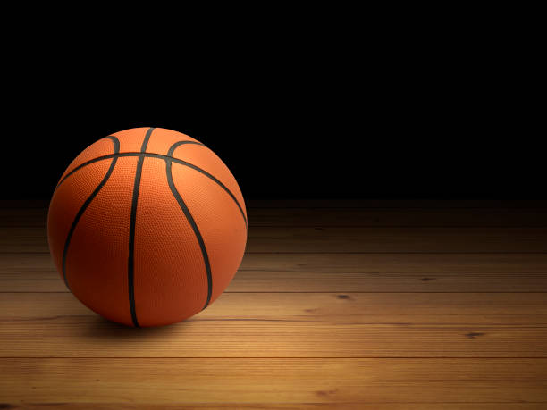 istock Basketball ball on the parquet with black background 1409820325