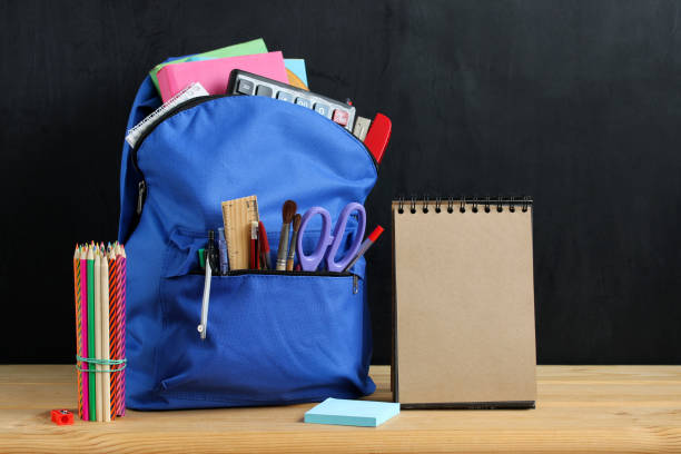 istock Preparation for school: blue backpack and stationery. 1409821288