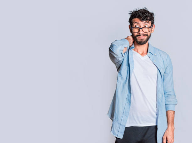 istock Person with uncomfortable face isolated on white background, Handsome man with uncomfortable expression isolated, Teenager with insecure expression 1409821338