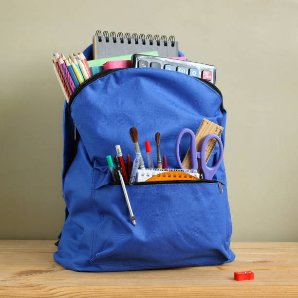 istock Blue backpack and stationery. The schoolboy's bag. 1409821499