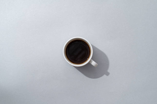 istock Top view of coffee cup on gray background 1409822112