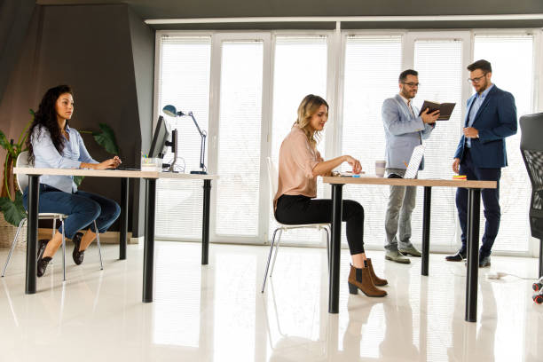istock Business people diligently working in a small corporate office space 1409823941