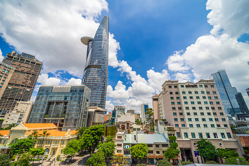 View of the iconic landmark in Saigon, Bitexco Financial Tower - skyscraper in Ho Chi Minh City, Vietnam with a helicopter landing pad at top, built as a symbol of Vietnam's new economic strength.