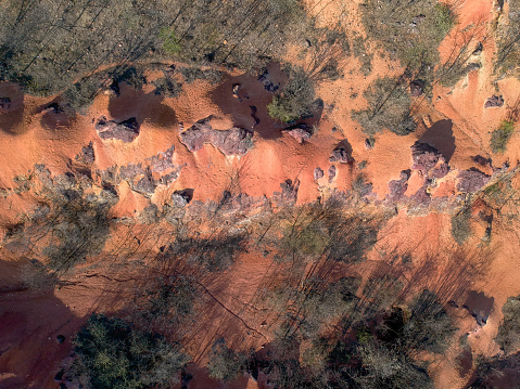 Raw weathered bauxite sedimentary rock on surfaceBauxite mine, raw weathered bauxite sedimentary rock