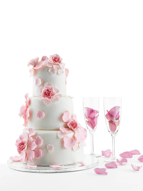istock Wedding Cake and champagne flute glasses On White Background 140983179