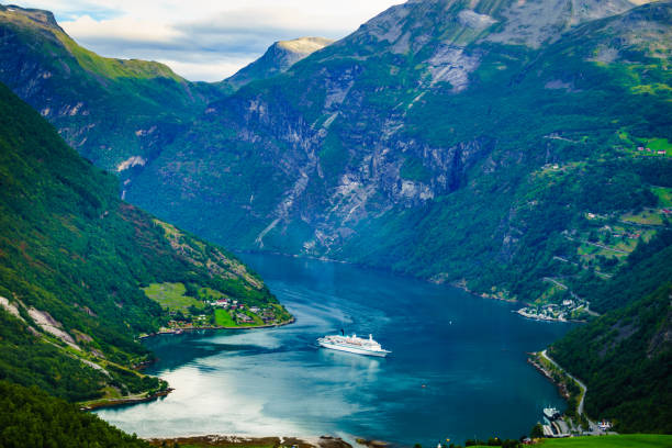 Fjord Geirangerfjord with cruise ship, Norway. Fjord Geirangerfjord with cruise ship, view from Flydasjuvet viewing point, Norway. Travel destination geirangerfjord stock pictures, royalty-free photos & images