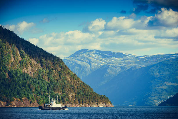 istock Fjord landscape with ferry, Norway 1409832673