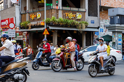 Saigon, Ho Chi Minh City, Vietnam - December 26, 2019: People and traffic in the city of Saigon in Vietnam