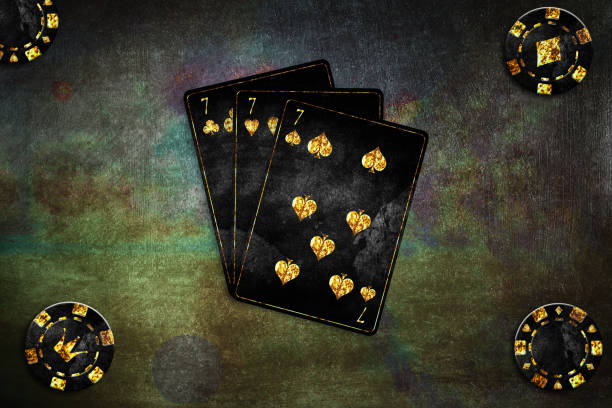 istock Vintage playing cards. Three sevens, and poker chips on a grunge, green poker background.Copy Space. Place for text. Vignette. Gamble banner. Playing cards. 1409834941