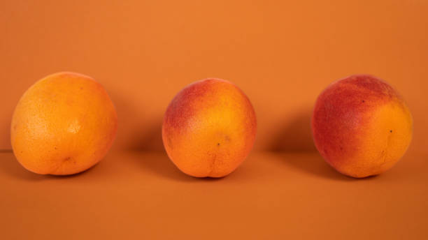 istock Apricots on an orange background 1409835600