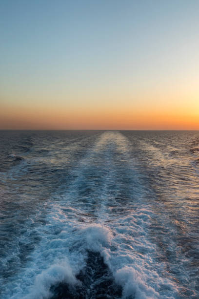 istock Sunset behind a ferry travelling across the Cyclades islands Greece 1409837032