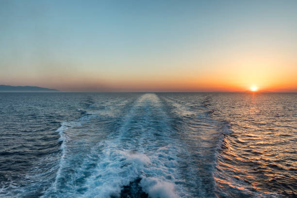 istock Sunset behind a ferry travelling across the Cyclades islands Greece 1409837068