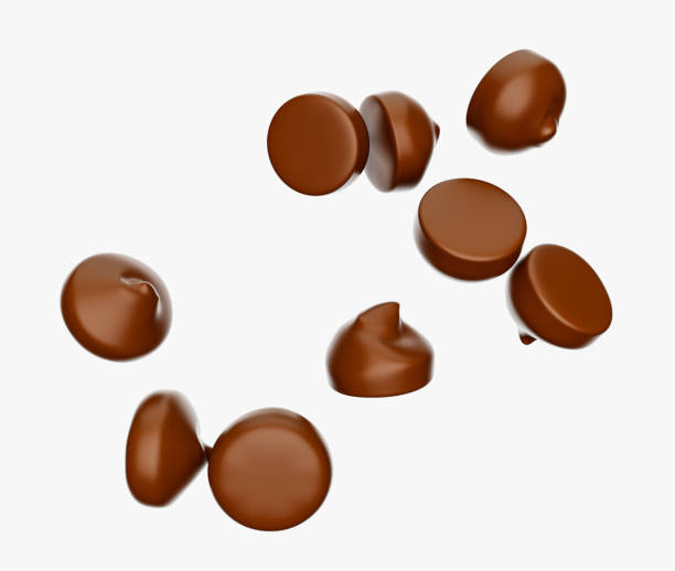 istock Chocolate chips morsels or drops, Falling flying isolated on white background 3d illustration 1409839415