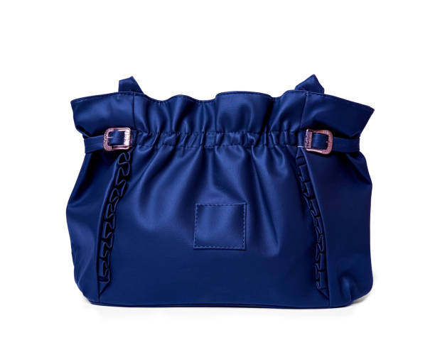 istock Women's blue leather handbag isolated on white background 1409839531