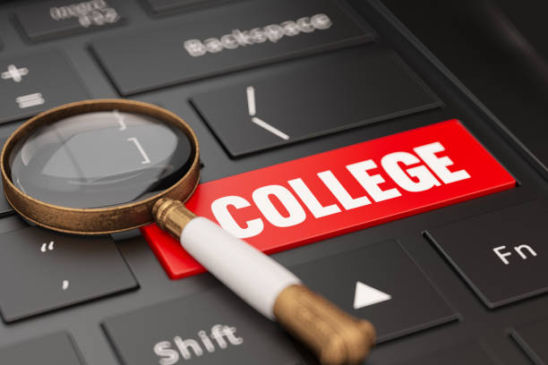 istock Online College Searching Concept with Keyboard and a Magnifying Glass 1409839873
