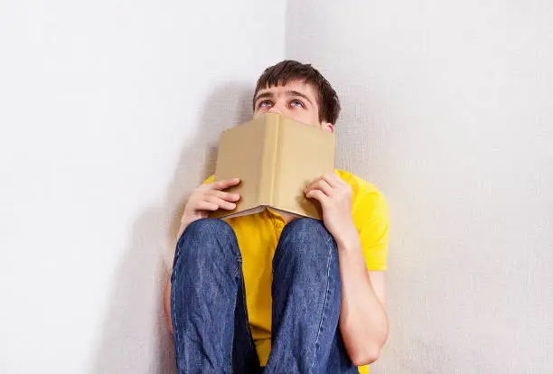 Student with a Books feel a Stress in the Corner