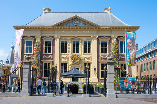 Royal Cabinet of Paintings Mauritshuis in The Hague exterior front view decorated with flowers to celebrate its 200th anniversary as a museum.  The museum collection contains works by Johannes Vermeer, Rembrandt van Rijn, Jan Steen, Paulus Potter, Frans Hals, Jacob van Ruisdael,