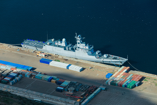 Superstructure of HMAS Adelaide moored at Garden Island in Sydney Harbour. This image was taken from Cowper Wharf at sunset in winter.