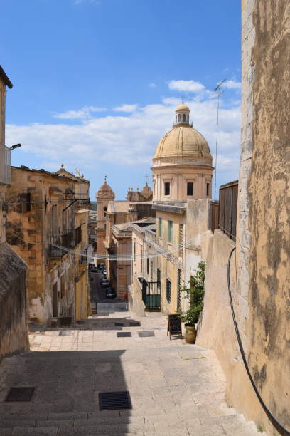 Vertical image of stairs and dome in baroque city of Noto, Sicily Vertical image of stairs and dome in baroque city of Noto, Sicily noto sicily stock pictures, royalty-free photos & images