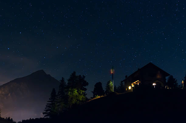 Mountain Landscape Night in the Alps, Mount Chaberton. Star in soft motion, grainy due to HIGH iso level