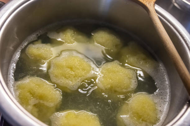 istock a pot full of dumplings in the water 1409846454