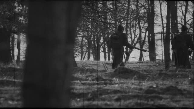 Silhouettes of soviet soldiers in a forest - archive