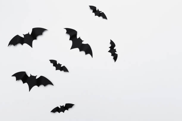 istock halloween and decoration concept - paper bats flying 1409850600