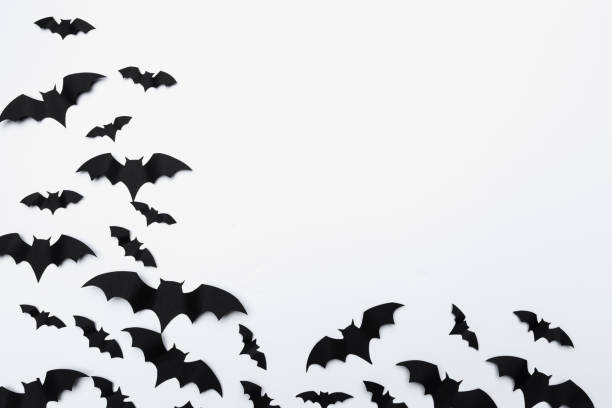 istock halloween and decoration concept - paper bats flying 1409850726