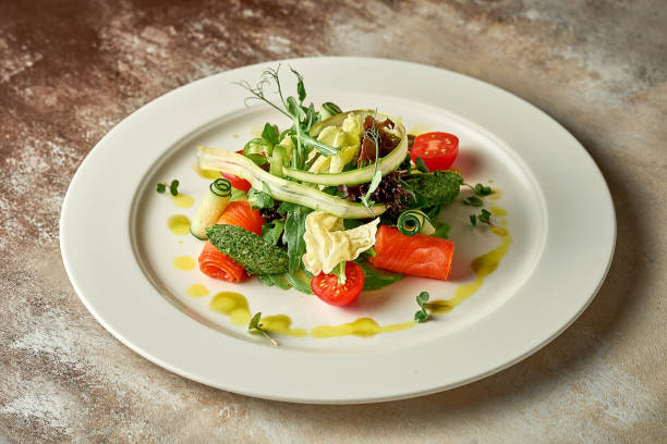 istock Salad with lightly salted salmon. Selective focus. Close-up. Noise in post-production 1409850773
