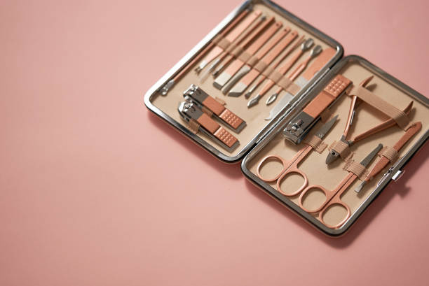 Pastel cosmetic set for nail care in a case placed on a pink background Pastel cosmetic set for nail care in a case placed on a pink background. Flat lay model kit stock pictures, royalty-free photos & images