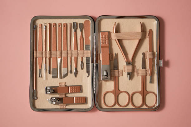 istock Pastel cosmetic set for nail care in a case placed on a pink background 1409850786