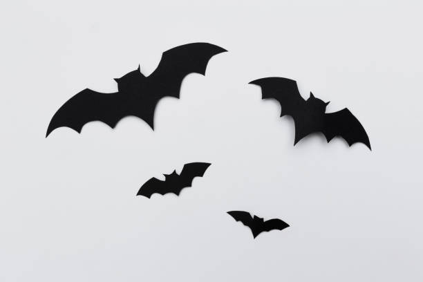 istock halloween and decoration concept - paper bats flying 1409850796