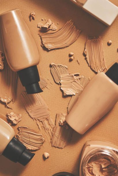 istock Bottles of makeup foundation and samples on beige background 1409850816