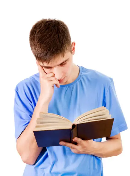 Young Man read a Book Isolated on the White Background