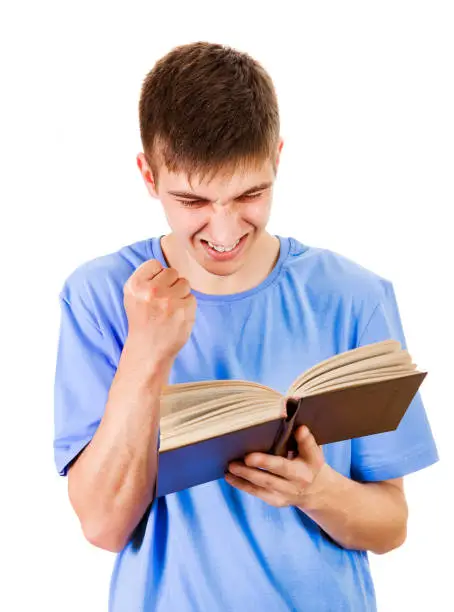Worried Young Man read a Book Isolated on the White Background
