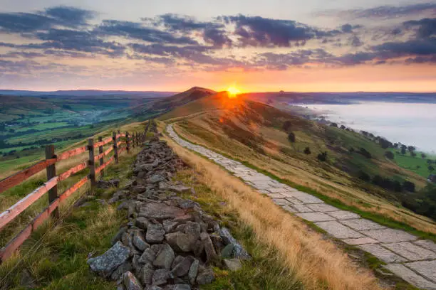 Wide angle view of sunrise along The Great Ridge with Edale and Hope Valley. Peak District National Park, England, UK.