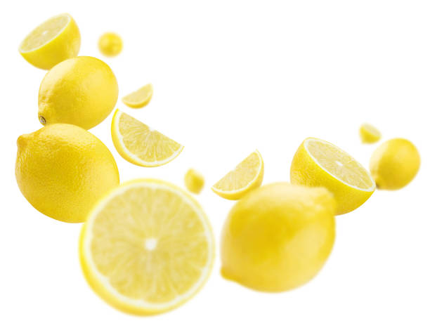 istock Flying lemon fruits on white 1409853996