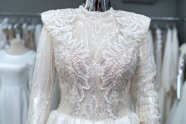 istock white wedding dresses on mannequin and away hanging on hangers 1409855666