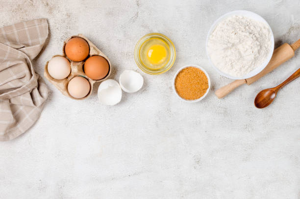 istock Ingredients for making dough dishes: cakes, cookies, muffins, pies on a gray background. 1409856306