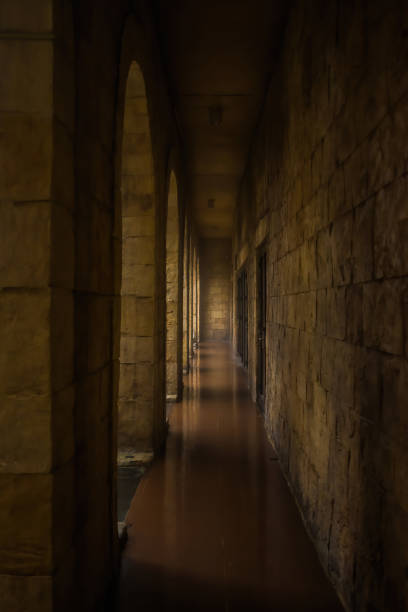 Dark corridors between rooms with light stock photo